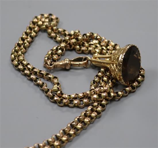 A Victorian 9ct gold guard chain hung with a yellow metal overlaid gem set fob seal,